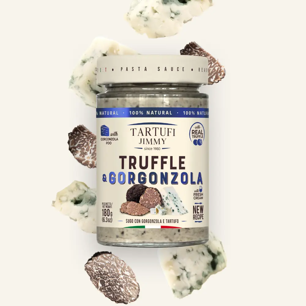 Буркан тартуфи джими трюфел и сос от сирене горгонзола с черни трюфели и парче сирене горгонзола отпред. Буркан тартуфи джими трюфел и сос от сирене горгонзола с черни трюфели и парче сирене горгонзола отпред.