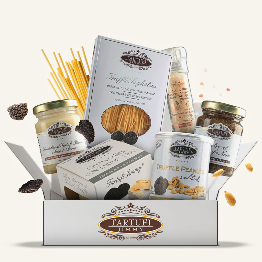 В отворена кутия Комплект "Трюфел премиум" са показани разнообразни продукти с трюфели, паста, сосове и фъстъци с трюфели.